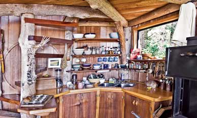 
The kitchen of a seaside homestead built primarily from driftwood.
